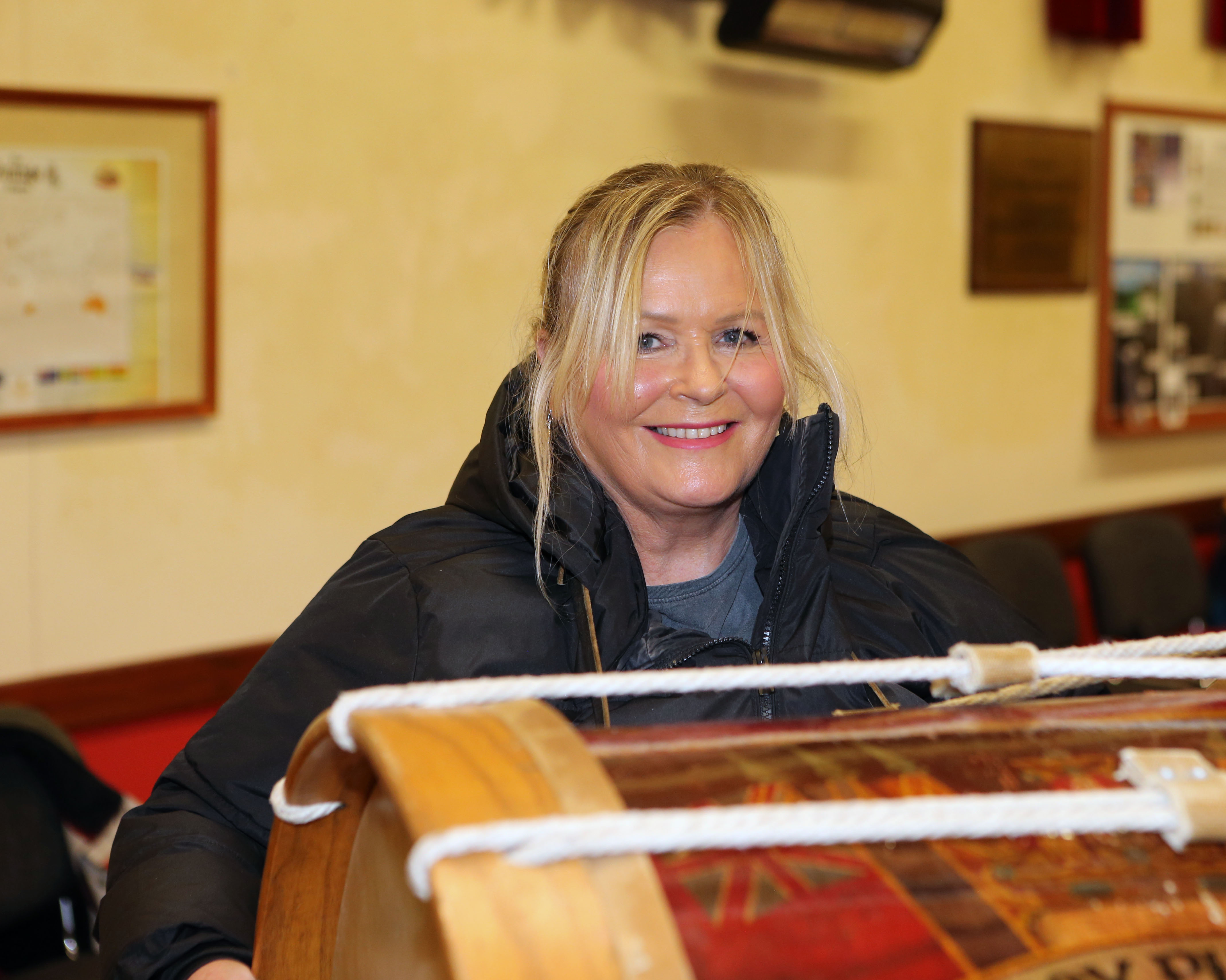 A woman standing behind a Lambeg drum